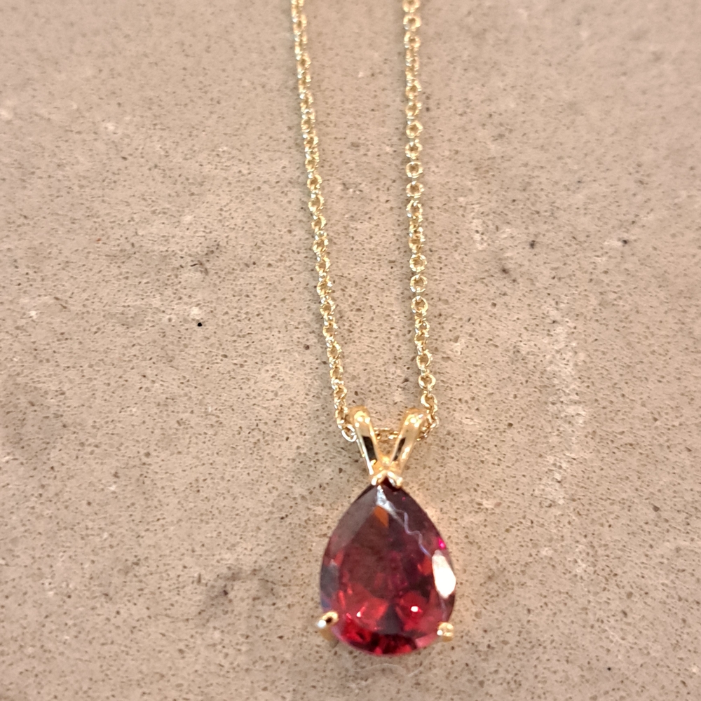 Elegant Gold Toned Necklace with Garnet Red Gemstone Pendant